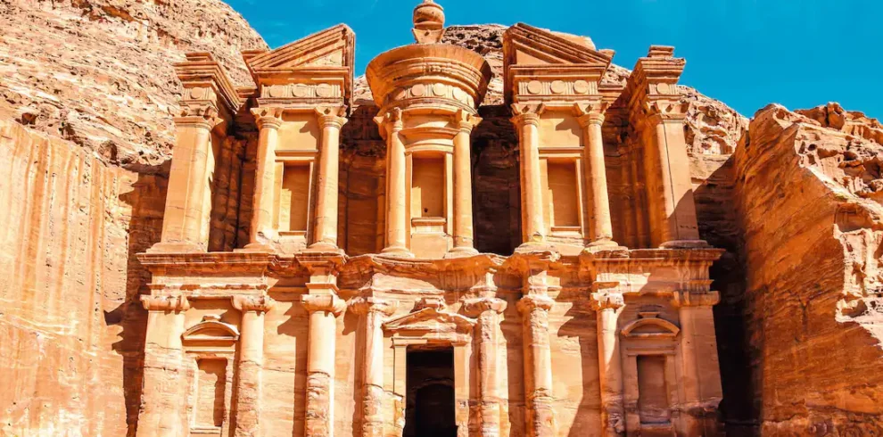 Petra’s Treasury carved into the rose-red sandstone cliffs, iconic ancient city in Jordan
