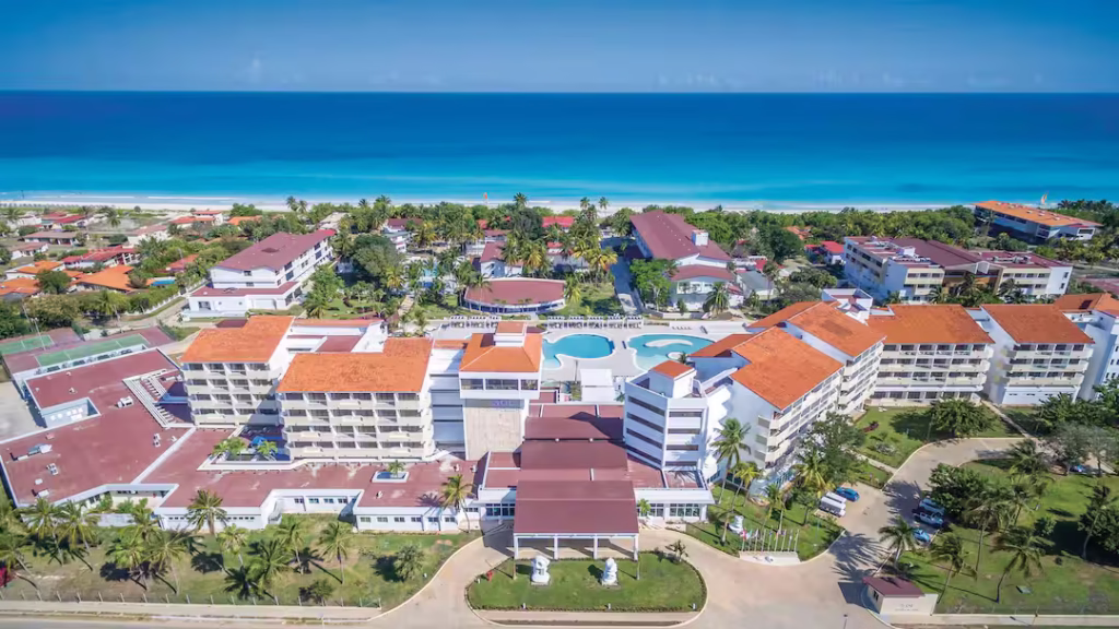 Aerial view of Meliá Caribe Beach Resort in Punta Cana with palm-lined beach and turquoise waters