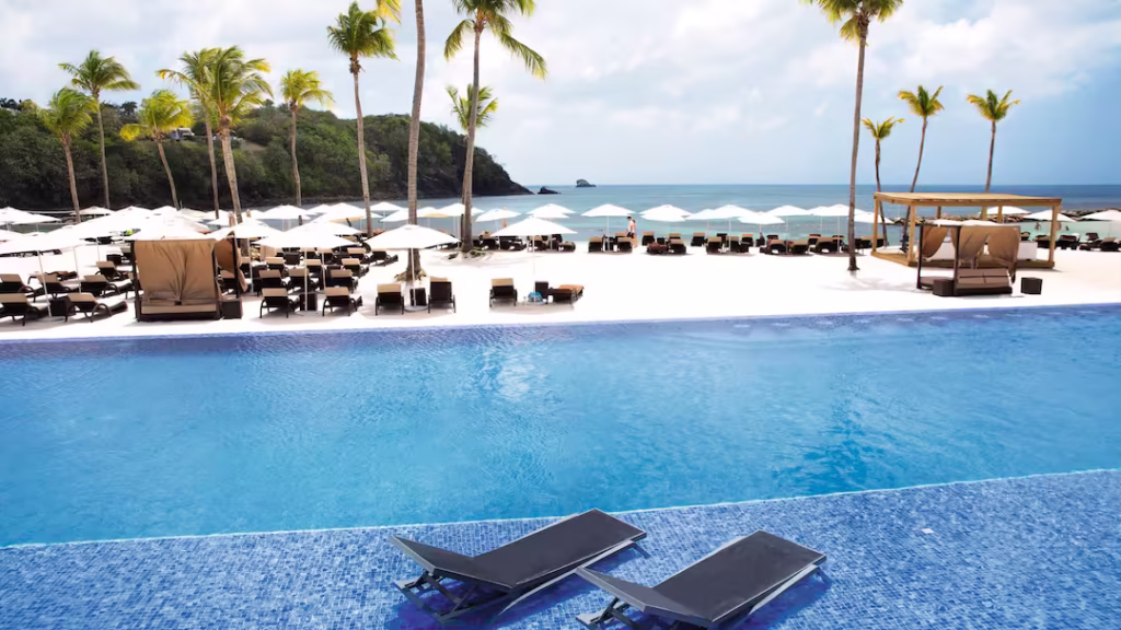 Oceanview pool at Royalton Saint Lucia with sun loungers and palm trees